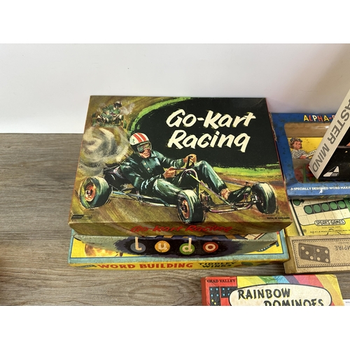 486 - A collection of mid 20th century boxed games to include Spear's Games DeLuxe Ludo and Snake & Ladder... 