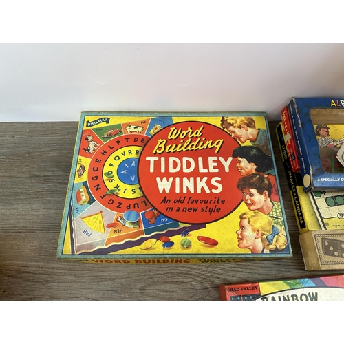 486 - A collection of mid 20th century boxed games to include Spear's Games DeLuxe Ludo and Snake & Ladder... 