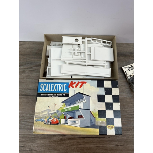 489 - Three Tri-ang Scalextric model racing items, boxed set of six F/30I track spectators, bagged A/223 p... 