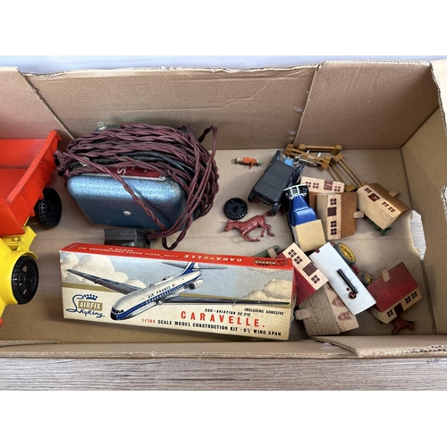 491 - A collection of vintage toys and accessories to include Tudor Rose plastic dumper truck, boxed Airfi... 