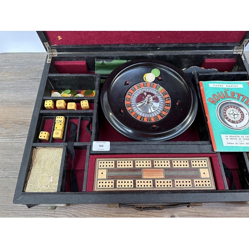 504 - A mid 20th century cased Roulette Wheel and accessories believed to be by K & C London