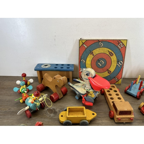 518 - A collection of mid 20th century toys to include Brio etc.