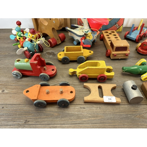 518 - A collection of mid 20th century toys to include Brio etc.