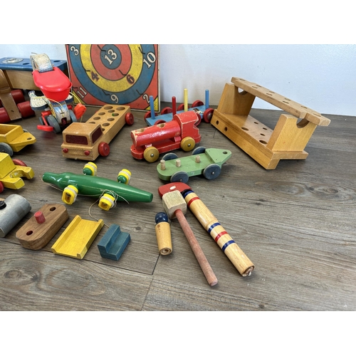 518 - A collection of mid 20th century toys to include Brio etc.