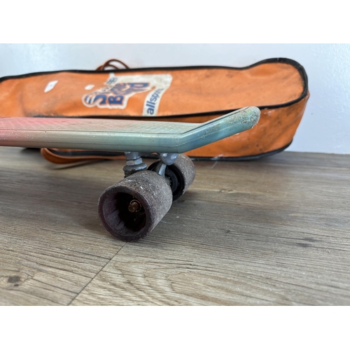 520 - A 1970s Lotus plastic skateboard with carrycase - approx. 60cm long