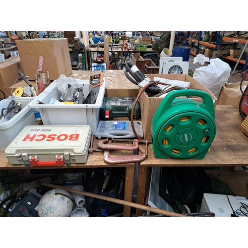 1070 - A large collection of tools to include pair of Record 1216 G-Clamps, cased Bosch jigsaw, nuts and bo... 