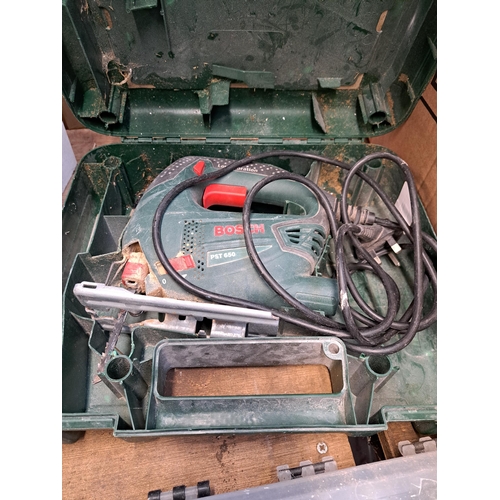 1070 - A large collection of tools to include pair of Record 1216 G-Clamps, cased Bosch jigsaw, nuts and bo... 