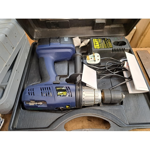 1071 - A collection of tools to include cased Powercraft cordless hammer drill with battery, charger and in... 