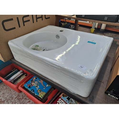 1090 - A boxed Cifial 60cm wash basin