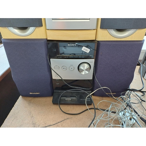 873 - Four items, one Sanyo DC-DA280 mini stereo system, one Sony HCD-FX300i mini stereo system with Sharp... 