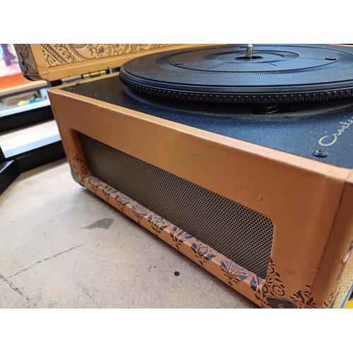 885 - A Crosley CR6249U-EM1 three-speed portable record player