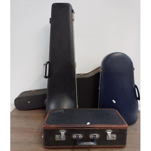 948 - Four musical instrument hard cases to include trumpet, acoustic guitar etc.