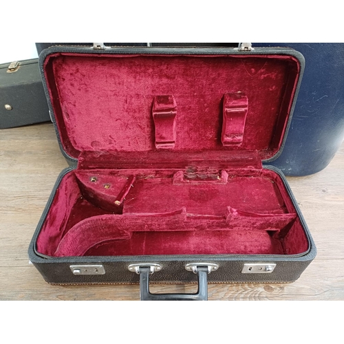 948 - Four musical instrument hard cases to include trumpet, acoustic guitar etc.