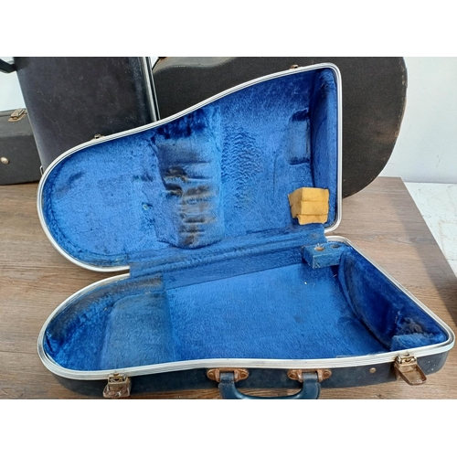 948 - Four musical instrument hard cases to include trumpet, acoustic guitar etc.