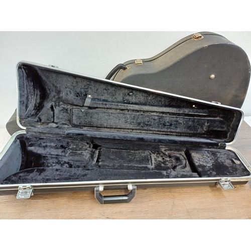 948 - Four musical instrument hard cases to include trumpet, acoustic guitar etc.