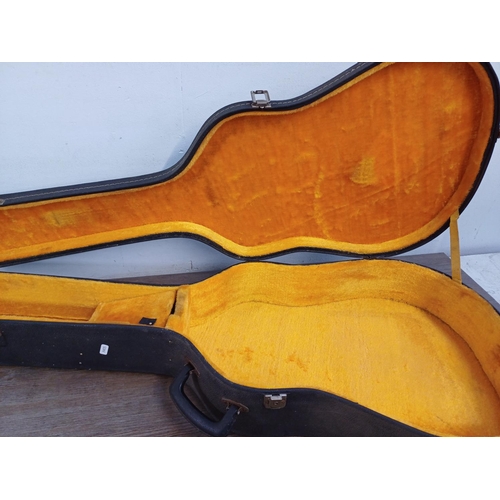 948 - Four musical instrument hard cases to include trumpet, acoustic guitar etc.