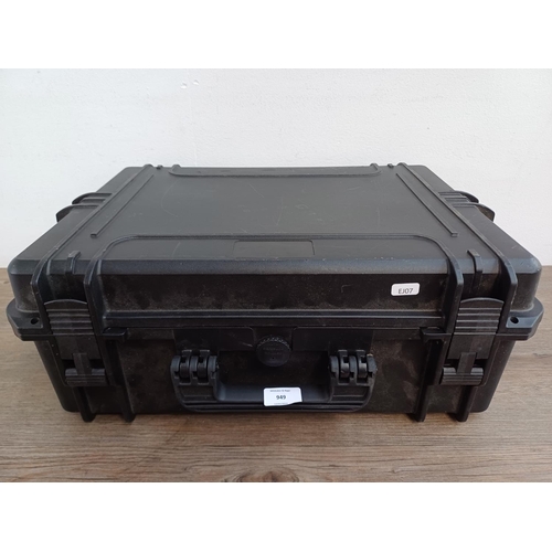 949 - A plastic flight case containing Shure SM58 professional cardioid dynamic microphone, cables etc.