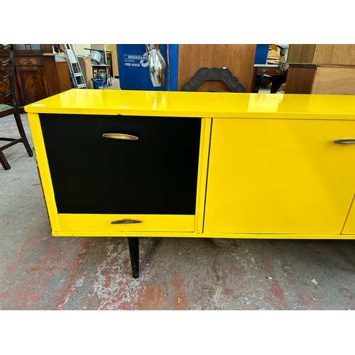 140A - A mid 20th century yellow and black vinyl wrapped sideboard - approx. 76cm high x 168cm wide x 44cm ... 