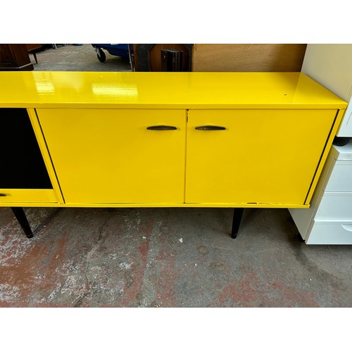 140A - A mid 20th century yellow and black vinyl wrapped sideboard - approx. 76cm high x 168cm wide x 44cm ... 