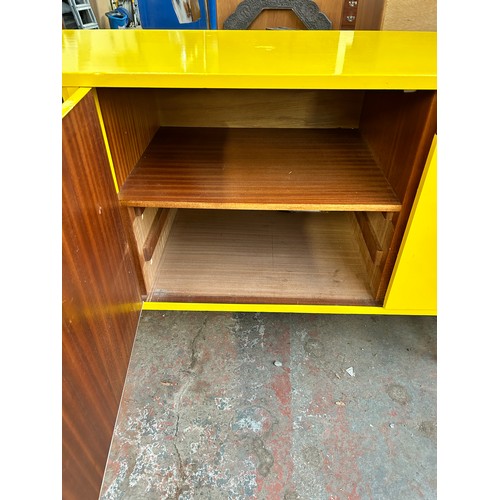 140A - A mid 20th century yellow and black vinyl wrapped sideboard - approx. 76cm high x 168cm wide x 44cm ... 