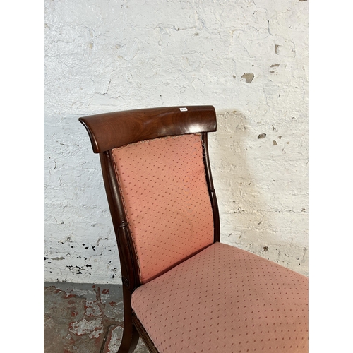 106 - A 19th century mahogany and pink fabric upholstered occasional chair on brass castors