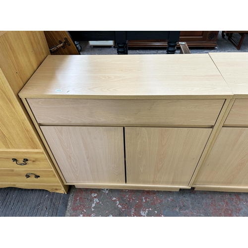 114 - Two modern beech effect sideboards - each approx. 80cm high x 79cm wide x 34cm deep