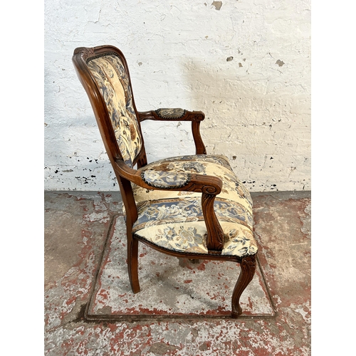 118 - A French style carved beech and floral upholstered open armchair