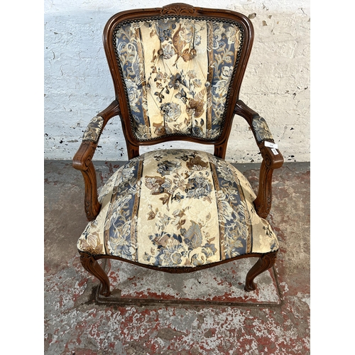 118 - A French style carved beech and floral upholstered open armchair