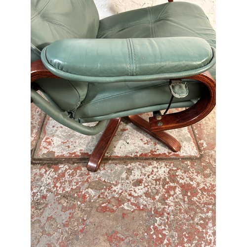 119 - A Stressless style green leather and bentwood swivel armchair