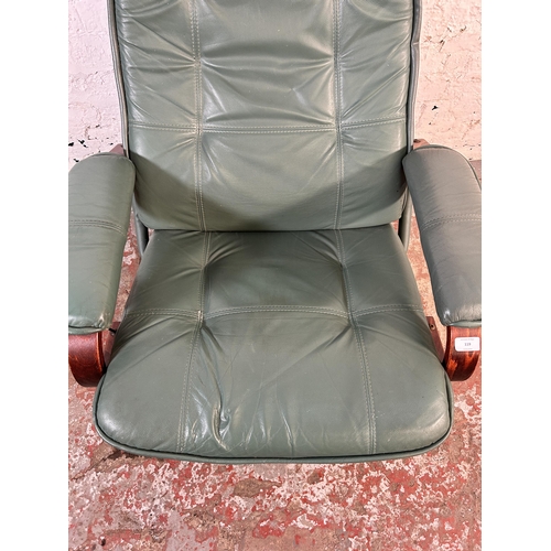 119 - A Stressless style green leather and bentwood swivel armchair