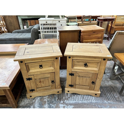 120 - A pair of Mexican pine bedside cabinets - approx. 66cm high x 53cm wide x 39cm deep