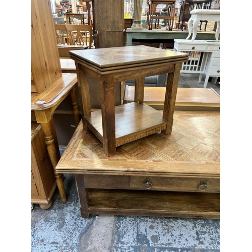 121 - Two mango wood occasional tables - largest approx. 45cm high x 70cm wide x 121cm long