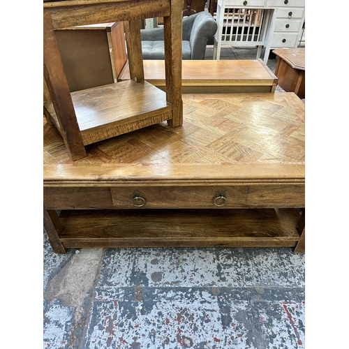 121 - Two mango wood occasional tables - largest approx. 45cm high x 70cm wide x 121cm long