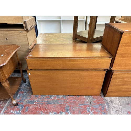 127 - Four 1970s teak wall units - largest approx. 37cm high x 82cm wide x 37cm deep