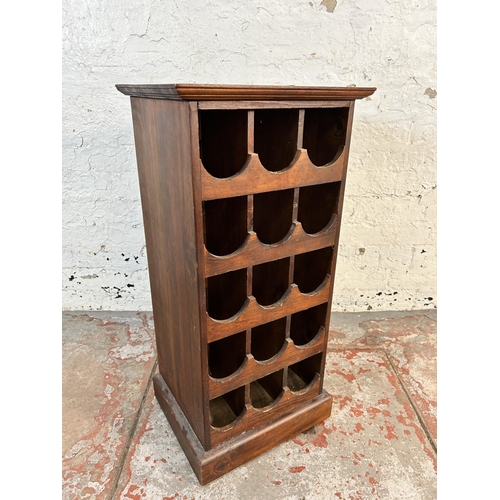 129 - A modern wood effect fifteen section bottle rack - approx. 80cm high x 38cm wide x 31cm deep