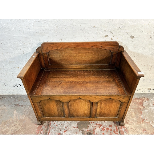 136 - A mid 20th century oak panelled storage bench - approx. 61cm high x 91cm wide x 3cm deep