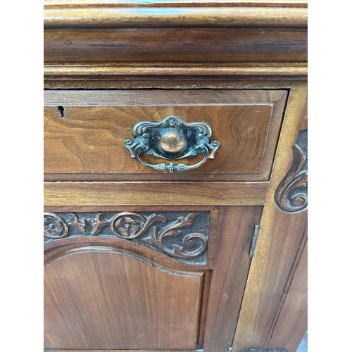 143 - A late Victorian/Edwardian carved walnut sideboard - approx. 87cm high x 150cm wide x 53cm deep