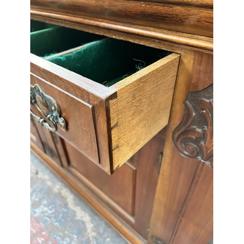 143 - A late Victorian/Edwardian carved walnut sideboard - approx. 87cm high x 150cm wide x 53cm deep