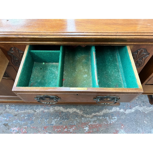 143 - A late Victorian/Edwardian carved walnut sideboard - approx. 87cm high x 150cm wide x 53cm deep