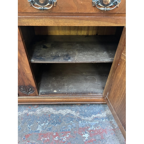 143 - A late Victorian/Edwardian carved walnut sideboard - approx. 87cm high x 150cm wide x 53cm deep