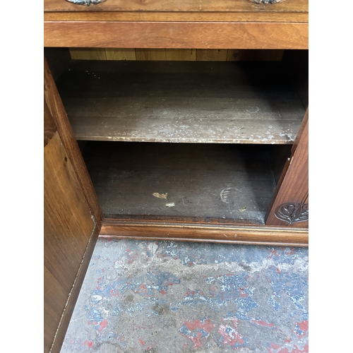 143 - A late Victorian/Edwardian carved walnut sideboard - approx. 87cm high x 150cm wide x 53cm deep