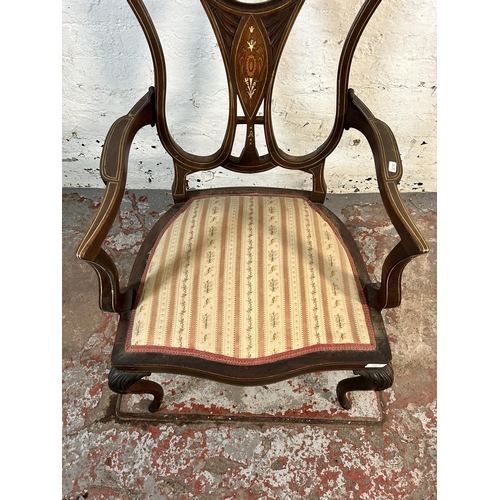 145 - An Edwardian inlaid mahogany and rosewood open armchair