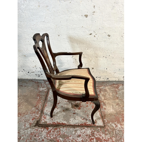 145 - An Edwardian inlaid mahogany and rosewood open armchair