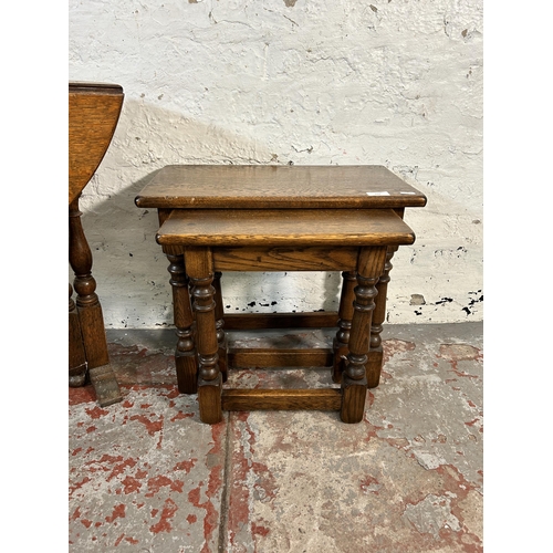 153 - Two pieces of oak furniture, one nest of tables and one oval drop leaf gate leg side table