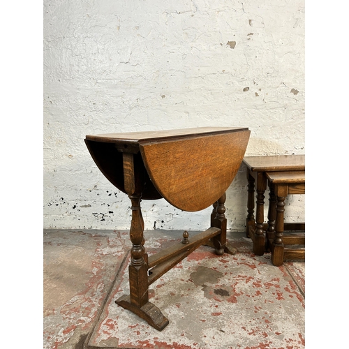 153 - Two pieces of oak furniture, one nest of tables and one oval drop leaf gate leg side table