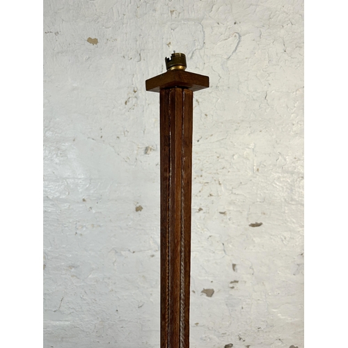 169 - An Art Deco oak standard lamp - approx. 166cm high