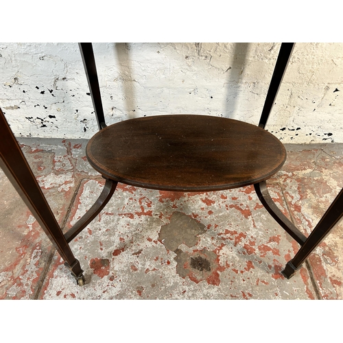 171 - An Edwardian inlaid mahogany oval two tier side table