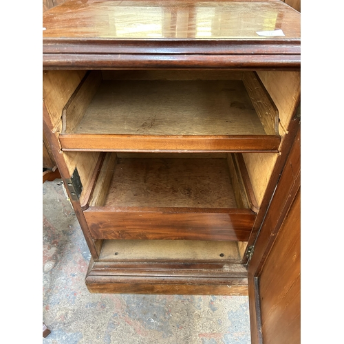 173 - A Victorian carved mahogany cabinet with fitted interior