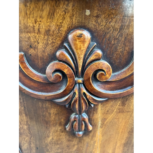 173 - A Victorian carved mahogany cabinet with fitted interior