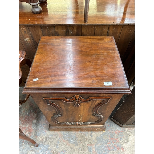 173 - A Victorian carved mahogany cabinet with fitted interior